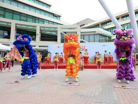 Students from S.R.B.C.E.P.S.A. Lu Kwong Fai Memorial School perform a lion dance with Chinese drums