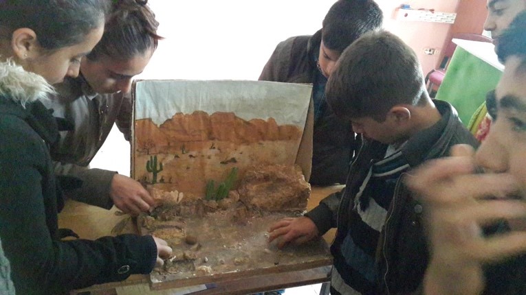 Picture 3. Students working with dioramas.