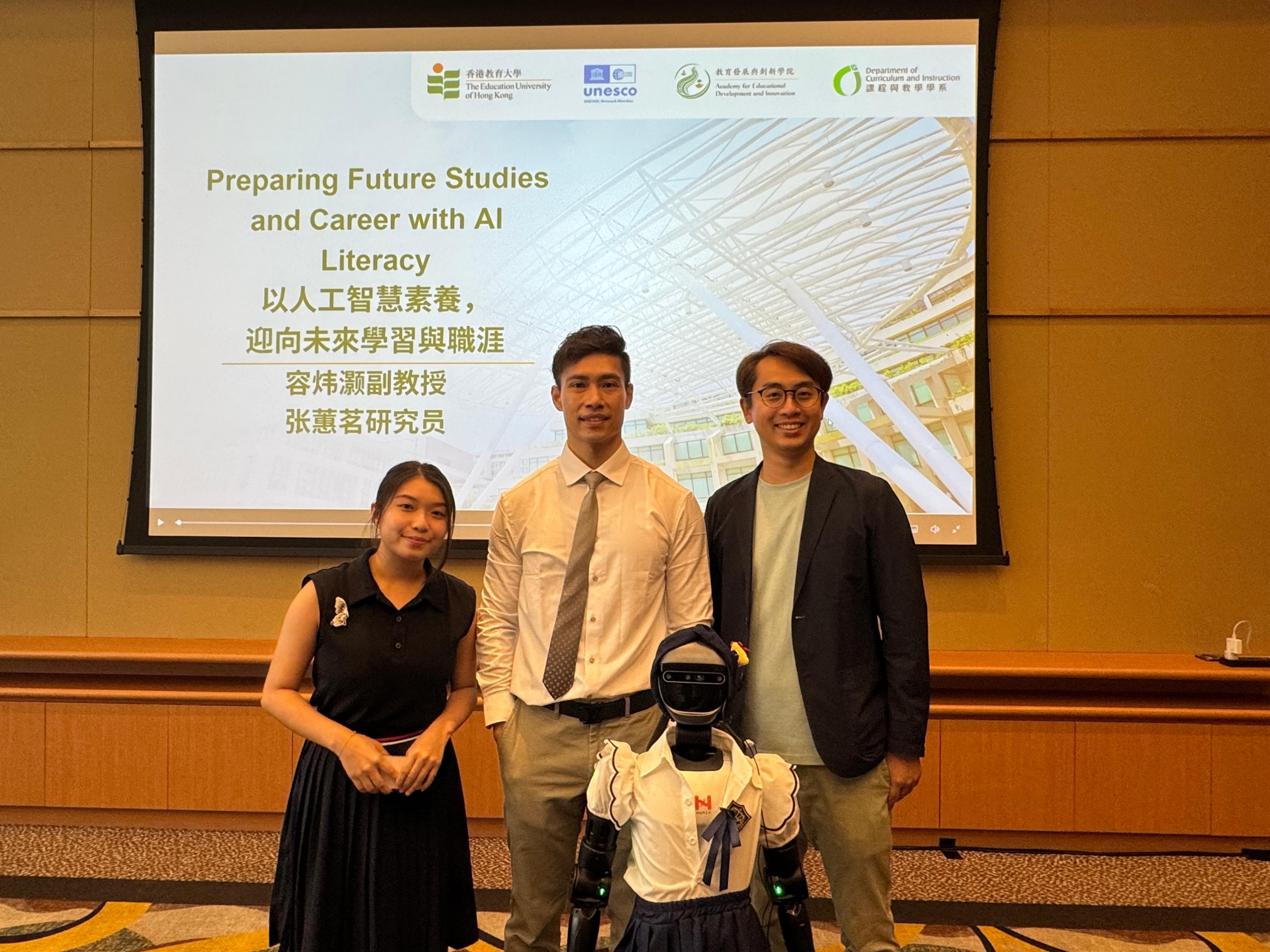 A group of people standing in front of a projector screenAI-generated content may be incorrect.