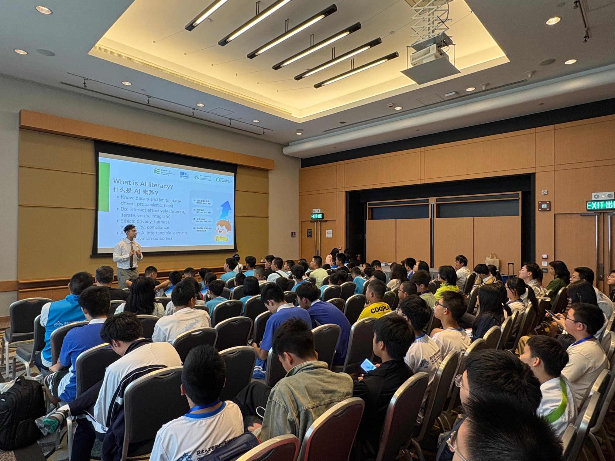 A group of people in a roomAI-generated content may be incorrect.