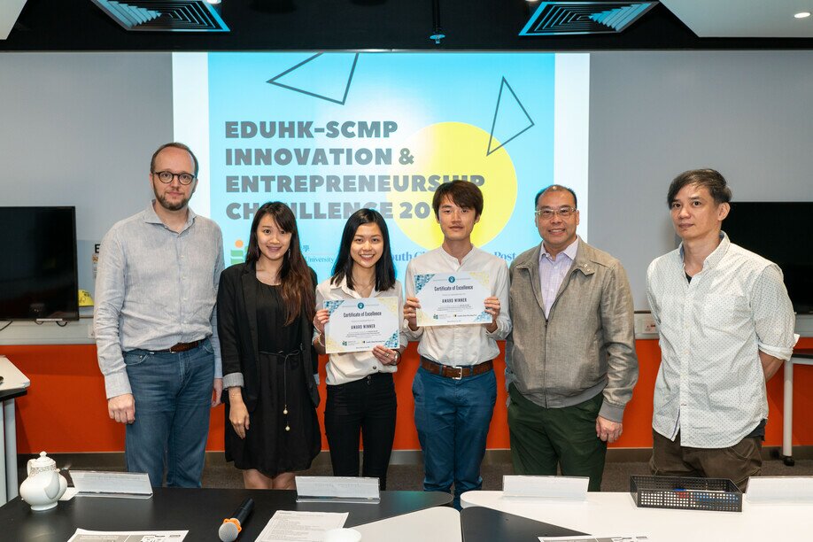 Two student representatives of the champion team “Foodster” (third and fourth from left) with the judges