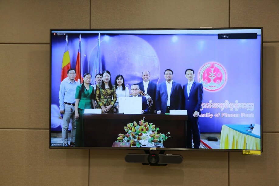 Dr Chet Chealy, Rector at the Royal University of Phnom Penh, signs the partnership agreement. 