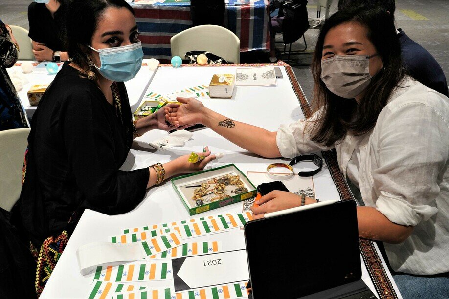 A student is given a henna tattoo