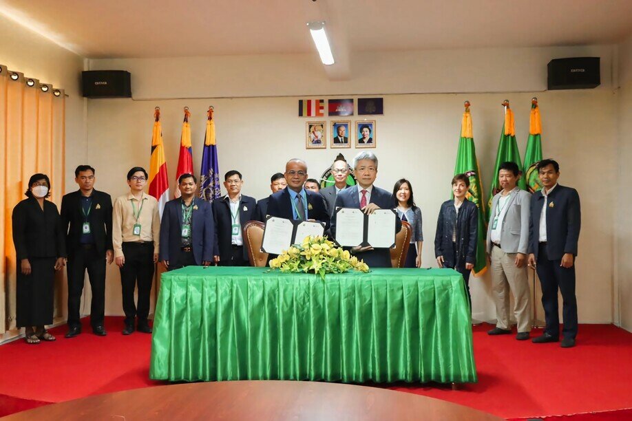 President Professor Stephen Cheung and the Rector of the National University of Battambang His Excellency Sok Khorn at an MoU signing ceremony