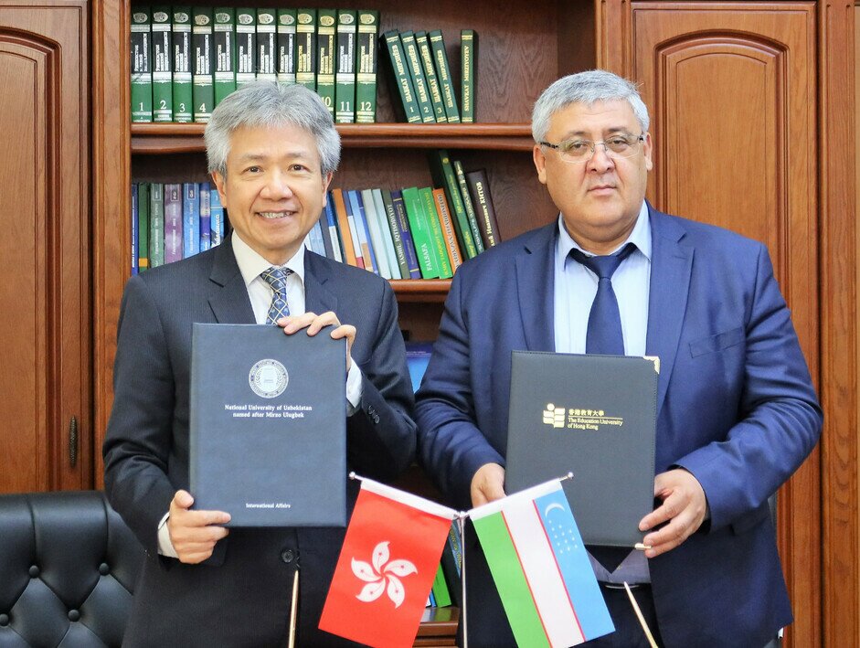 张教授(左) 与Madjidov Inom Urishevich教授 (右) 于5月22日，签订两所大学之间的合作协议