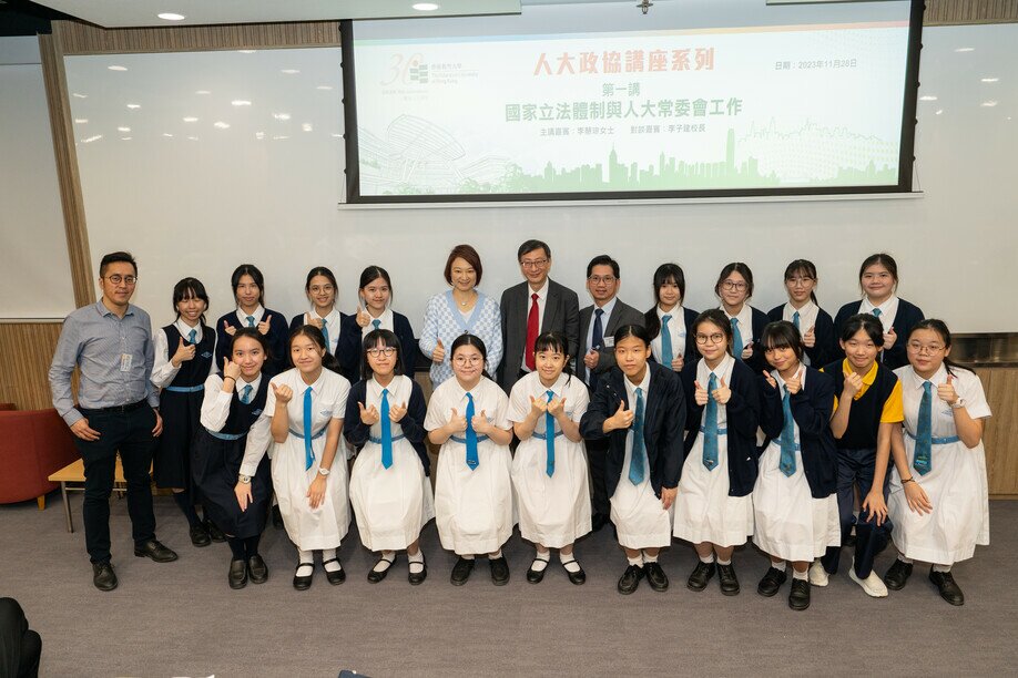 Professor John Lee and the Hon Starry Lee with Principal Mr Kenneth Law (fifth from right), teacher and students of St. Francis’ Canossian College