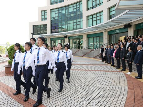  The national, regional and university flags are raised by a team made up of EdUHK students