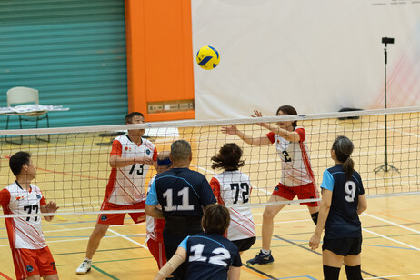 The participating teams showcase their sportsmanship and determination on court