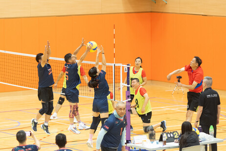 The participating teams showcase their sportsmanship and determination on court