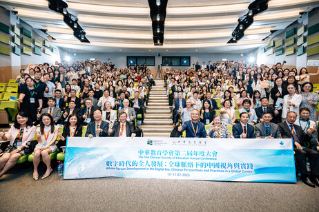 Conference participants pose for a group photo