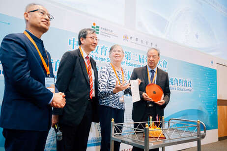 Professor John Lee Chi-Kin leads conference participants in celebrating Professor Ruth Hayhoe’s 80th birthday