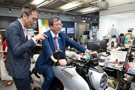 A delegation from EdUHK visits startups at Cyberport. EdUHK President Professor John Lee Chi-Kin experienced a ride on the first electric motorcycle developed by a Hong Kong startup