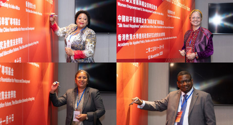Government officials, ambassadors to China and representatives of international women’s organizations from Asia and Africa sign the guest wall