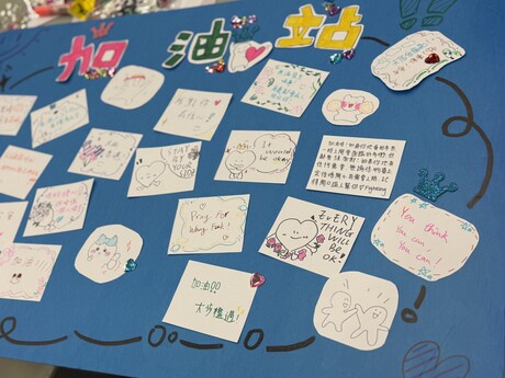 EdUHK students write cards of encouragement to support those affected by the fire