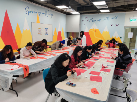 Students integrate the themes of Integrity, Honesty, and Creativity into traditional Fai Chun and paper-cutting designs