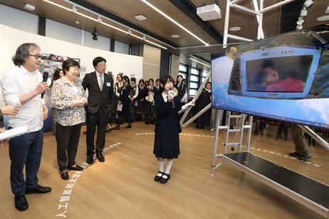 Guests tour the student works exhibition