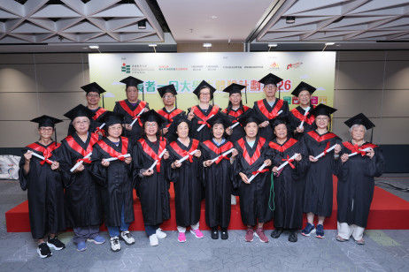 Participants don graduation gowns and receive certificates