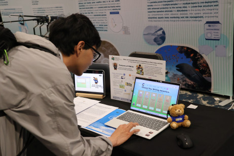 A visitor explores EdUHK’s innovations at the University's booth