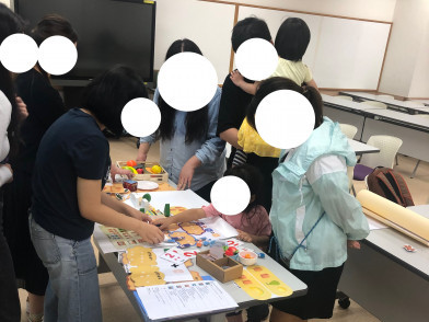 Playful Learning of Math Equivalence: Design, Testing, and Analysis of a Game with Children and Caregivers 