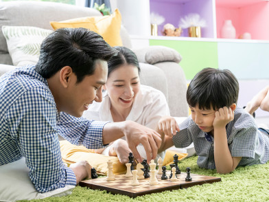 One Stone, Three Birds? Effects of Joint Play of Digital Versus Non-digital Number Board Games on Young Children, Parents and Their Relationship