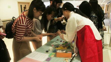 Participants used Korean alphabet stamps to print their names on bookmarks.