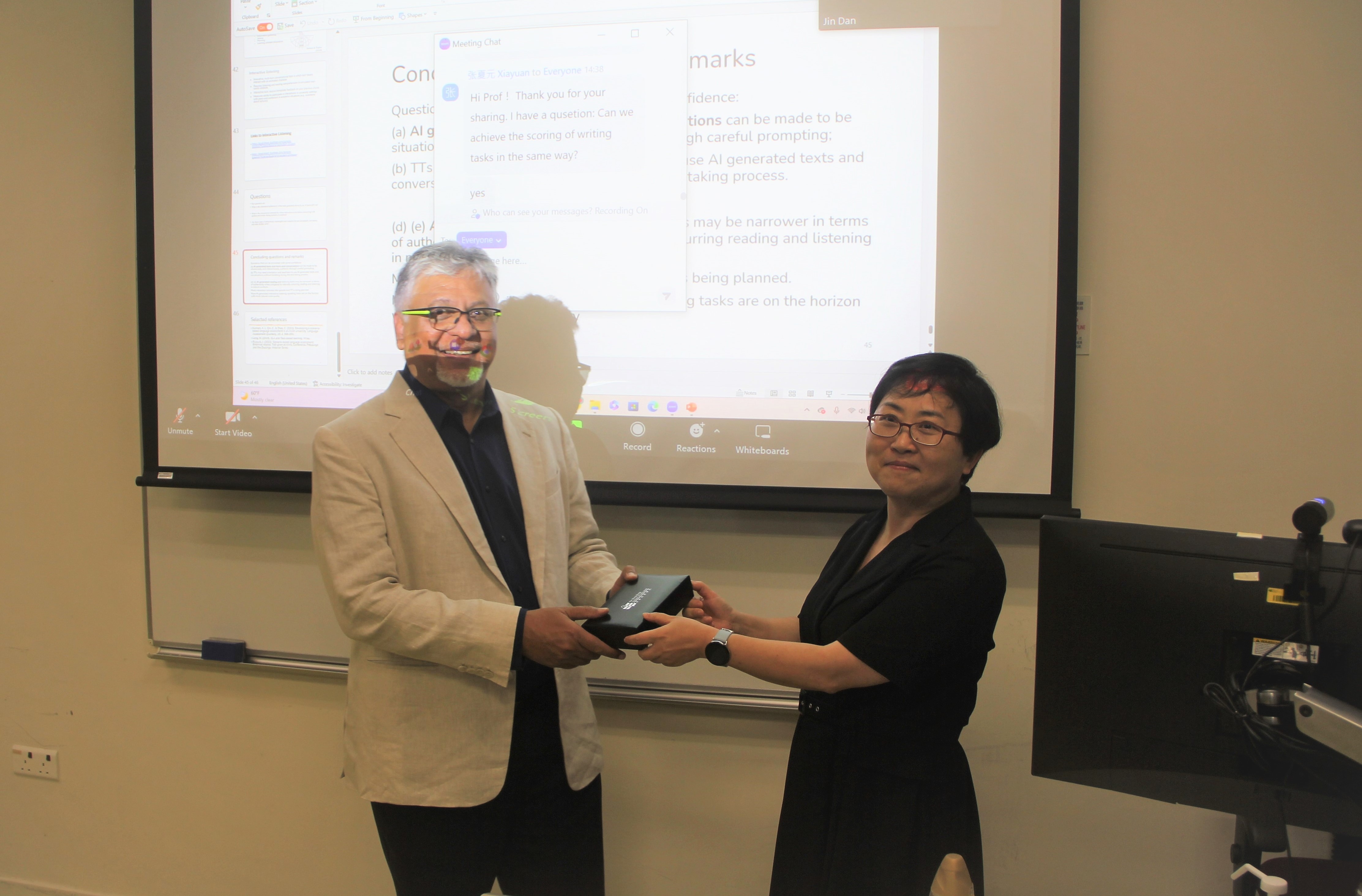 Dr Xie Qin presented Prof Kunnan with a souvenir on behalf of LML