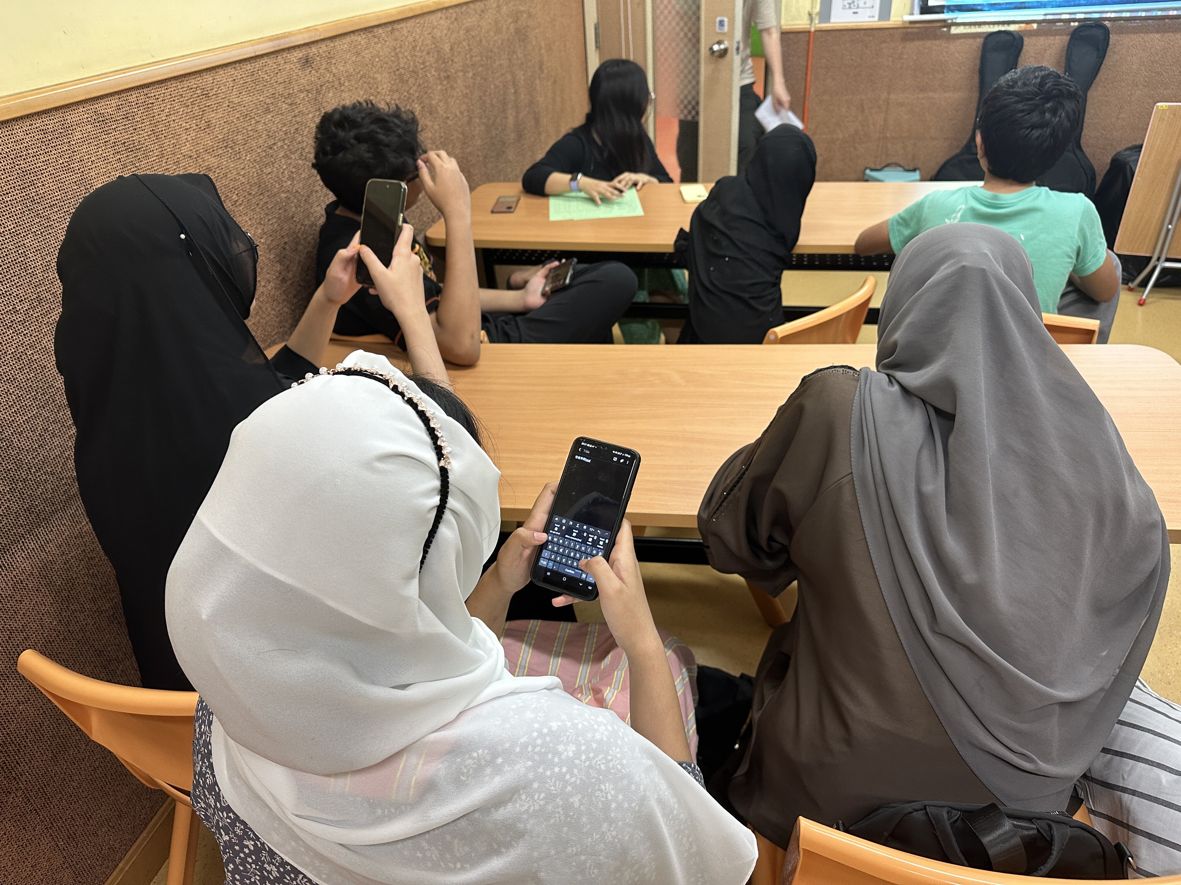 The team introduces TypeDuck to ethnic minorities at a community centre 
