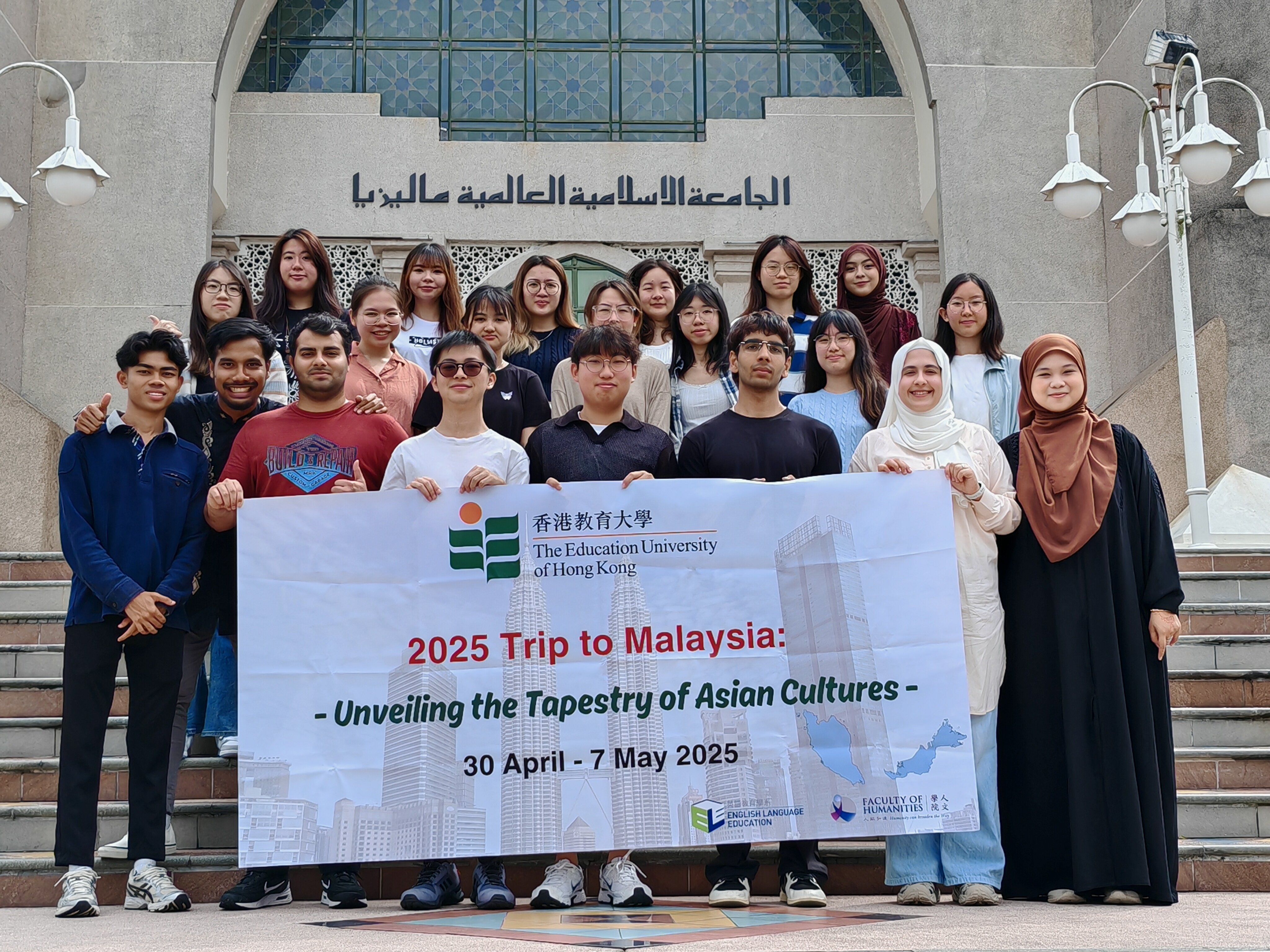 Capturing memories with a group photo at the steps of IIUM where friendships were forged