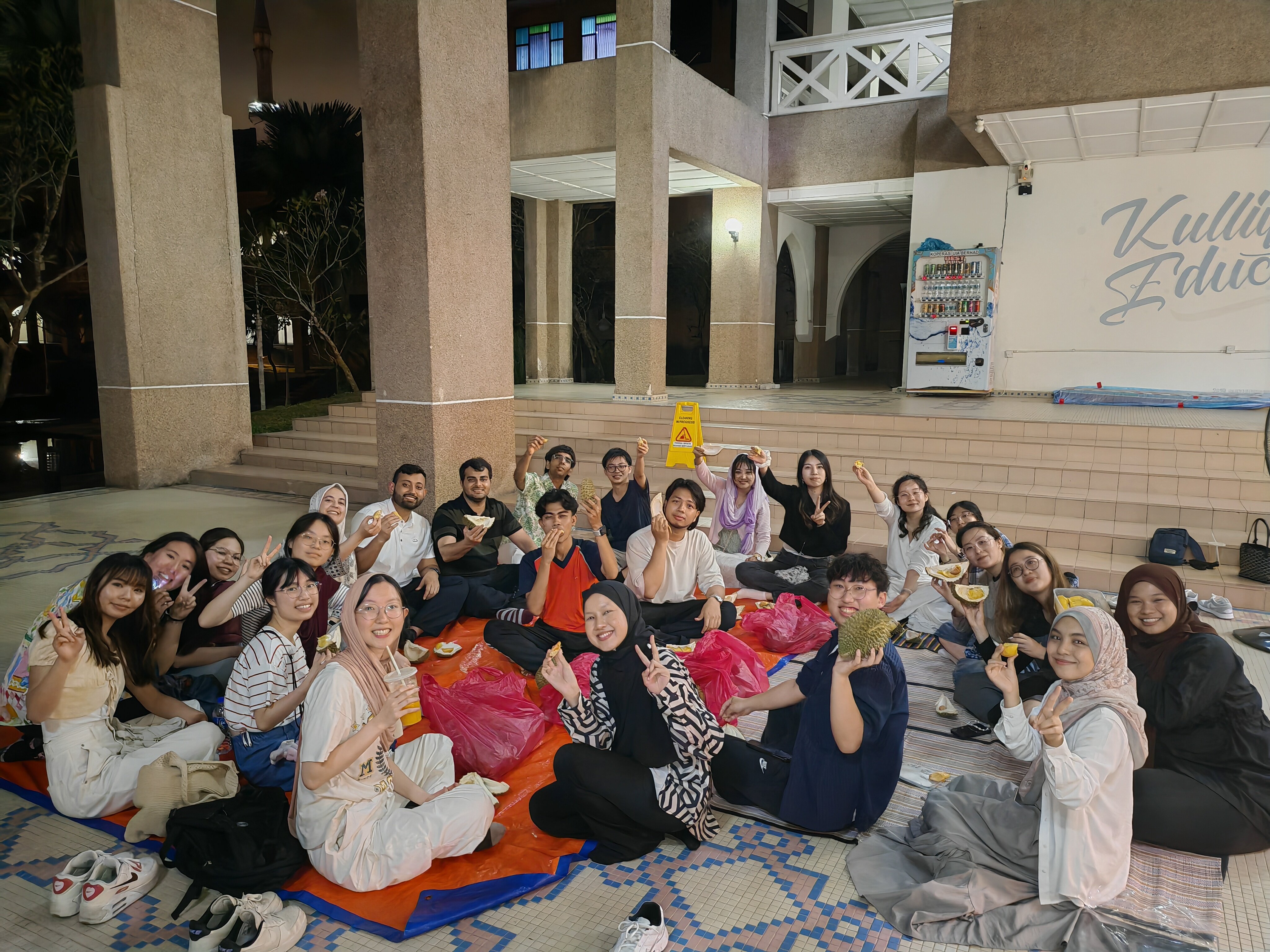 Enjoying a lively Cultural Night at IIUM complete with durians and delightful company