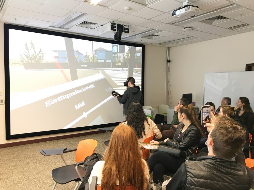 An Austrian student trying the VR simulation of earthquake in Virtual Reality Resources and Teaching Room.